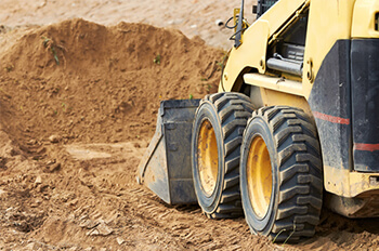 Skidsteer Preparing Land For New Development